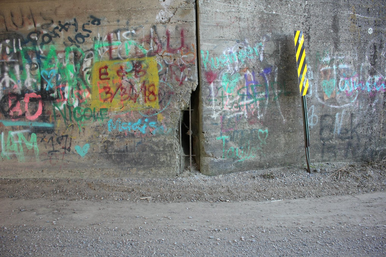 Deep hole at joint with northwest wing wall